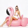 Giant inflatable flamingos ride on floating objects in the swimming pool, equipped with fast valve swimming rafts, suitable for summer party decoratio